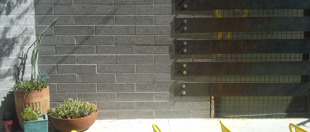 Exterior hardscape design | Fireplace Hearth in Restaurant Entertainment Area Outside | Joyride Taco Place